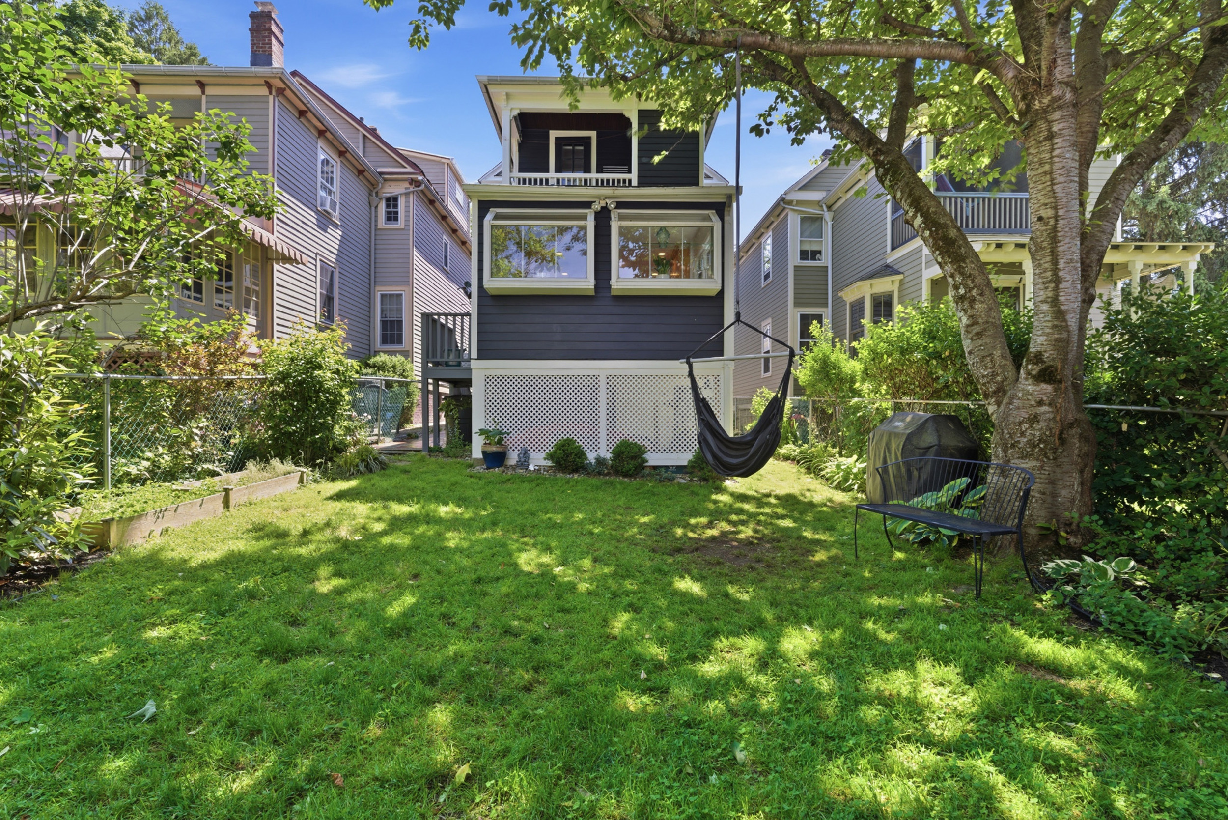 Backyard lawn and mature shade tree at 27 N. Dutcher St, Irvington